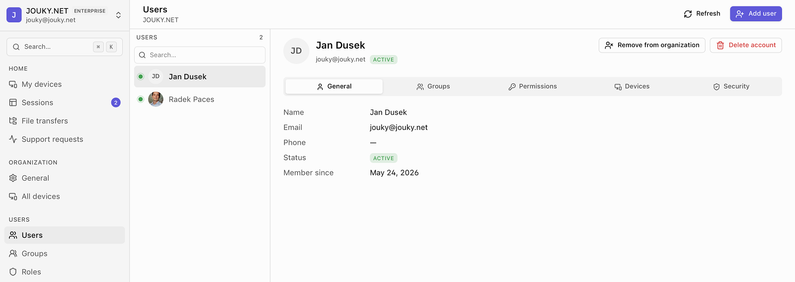 The ShareGlo admin console showing the users list alongside a member's profile, groups and permissions.